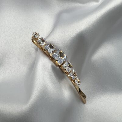 Metalinis aukso spalvos plaukų segtukas dekoruotas kvadratiniais cirkoniais