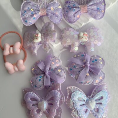 Purpurinių spalvų žaismingi plaukų segtukai mergaitėms