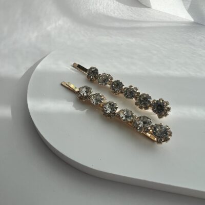 Metaliniai aukso spalvos plaukų segtukai dekoruoti skaidriais akmenukais